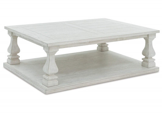 MESA CENTRO ARLENDYNE Hecha con sólidos de madera dura, chapa de olmo, sustratos MDF y resina fundida. Acabado en blanco envejecido                                         1.37*1.01*0.45